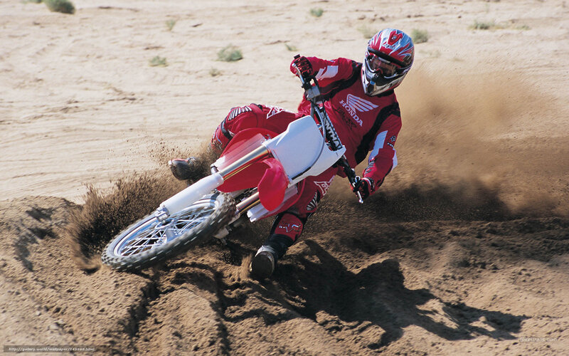 Motocross rider on dirt track
