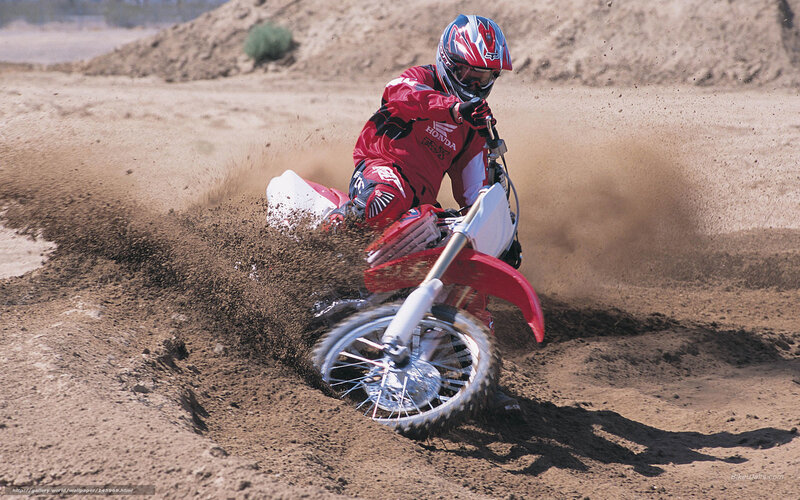 Motocross rider on dirt track
