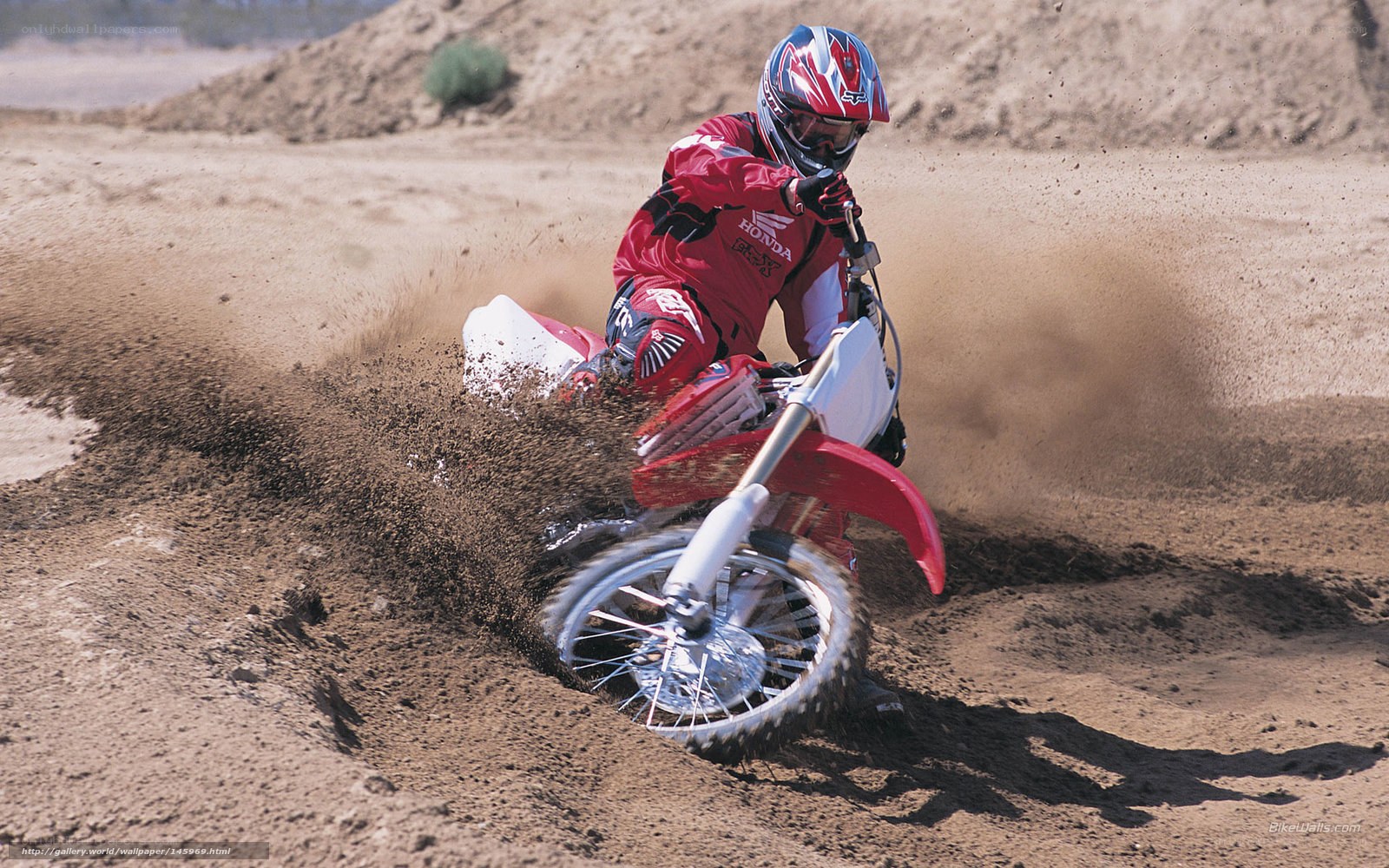 Motocross rider on dirt track