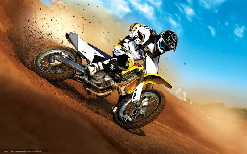 Motocross rider on dirt track