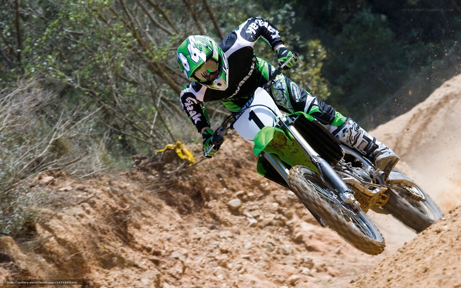 Motocross rider on dirt track