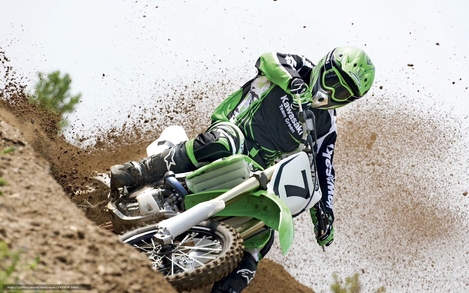 Motocross rider on dirt track