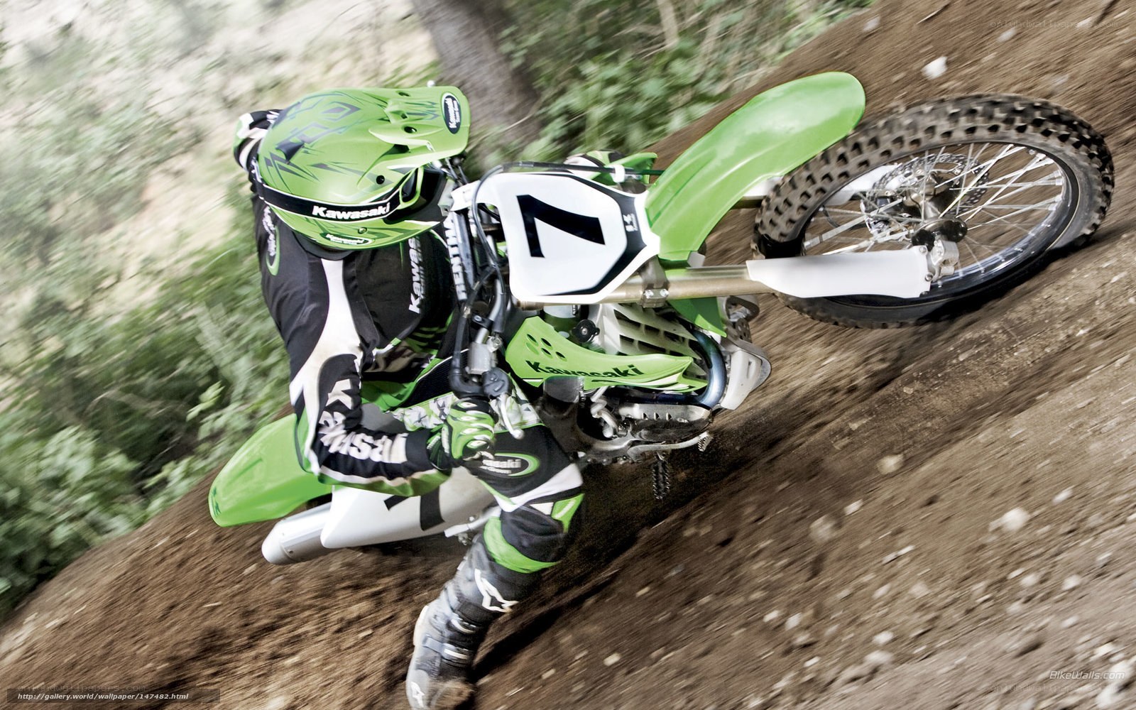Motocross rider on dirt track