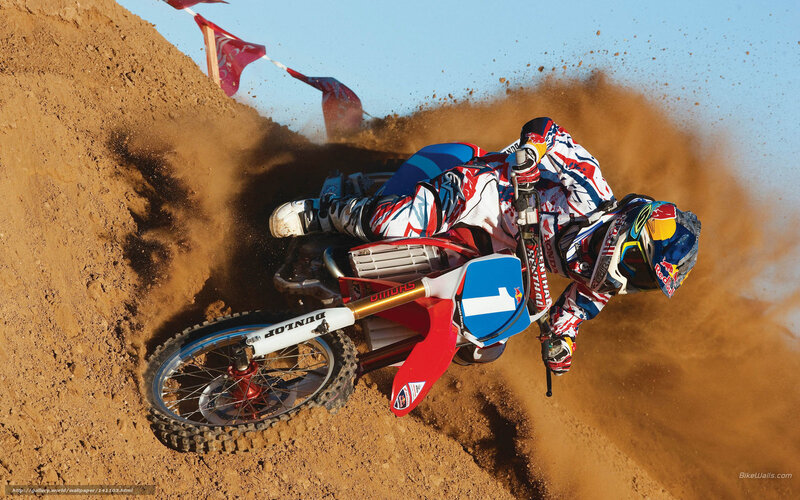 Motocross rider on dirt track