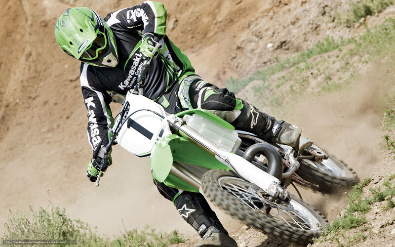 Motocross rider on dirt track
