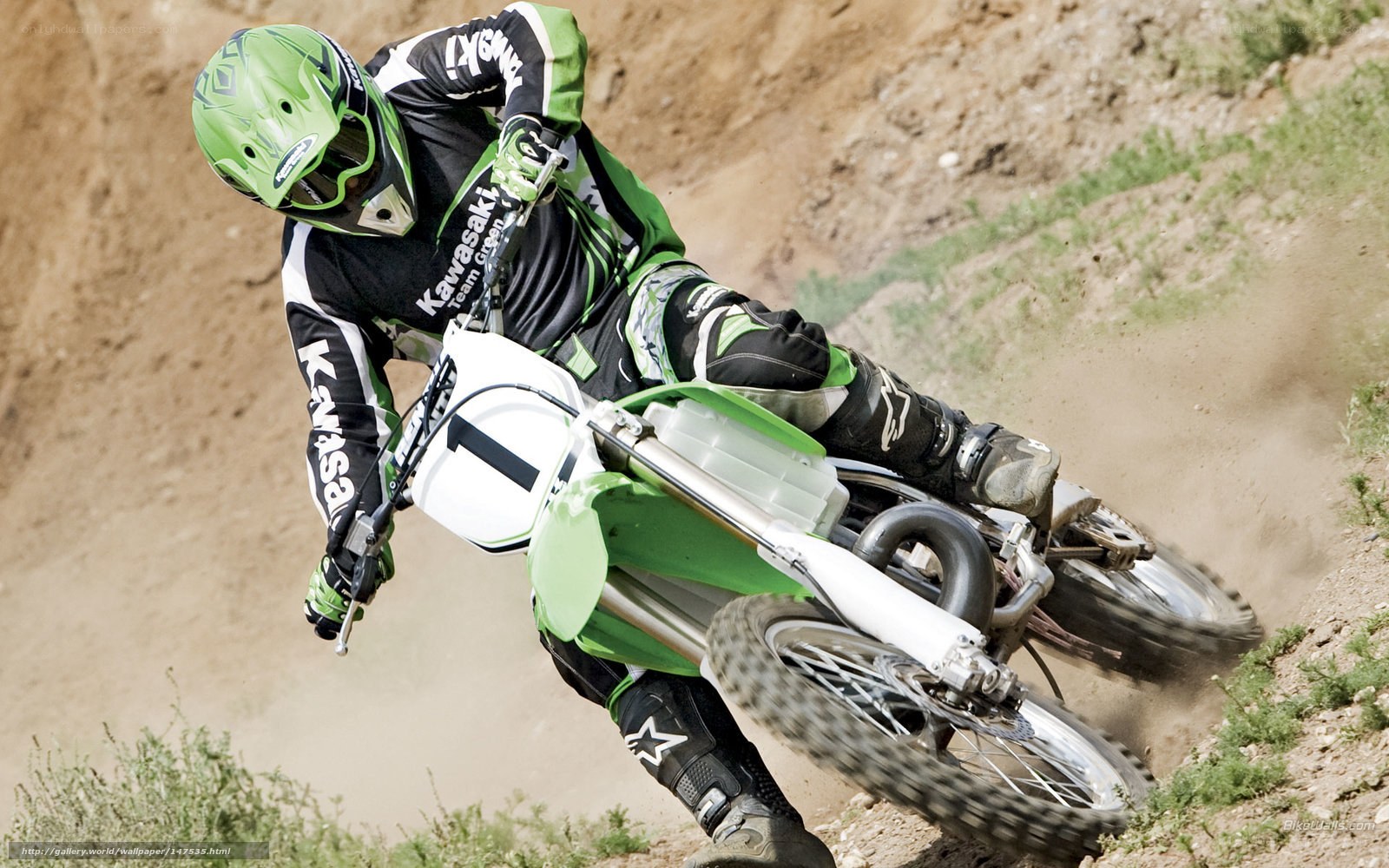 Motocross rider on dirt track