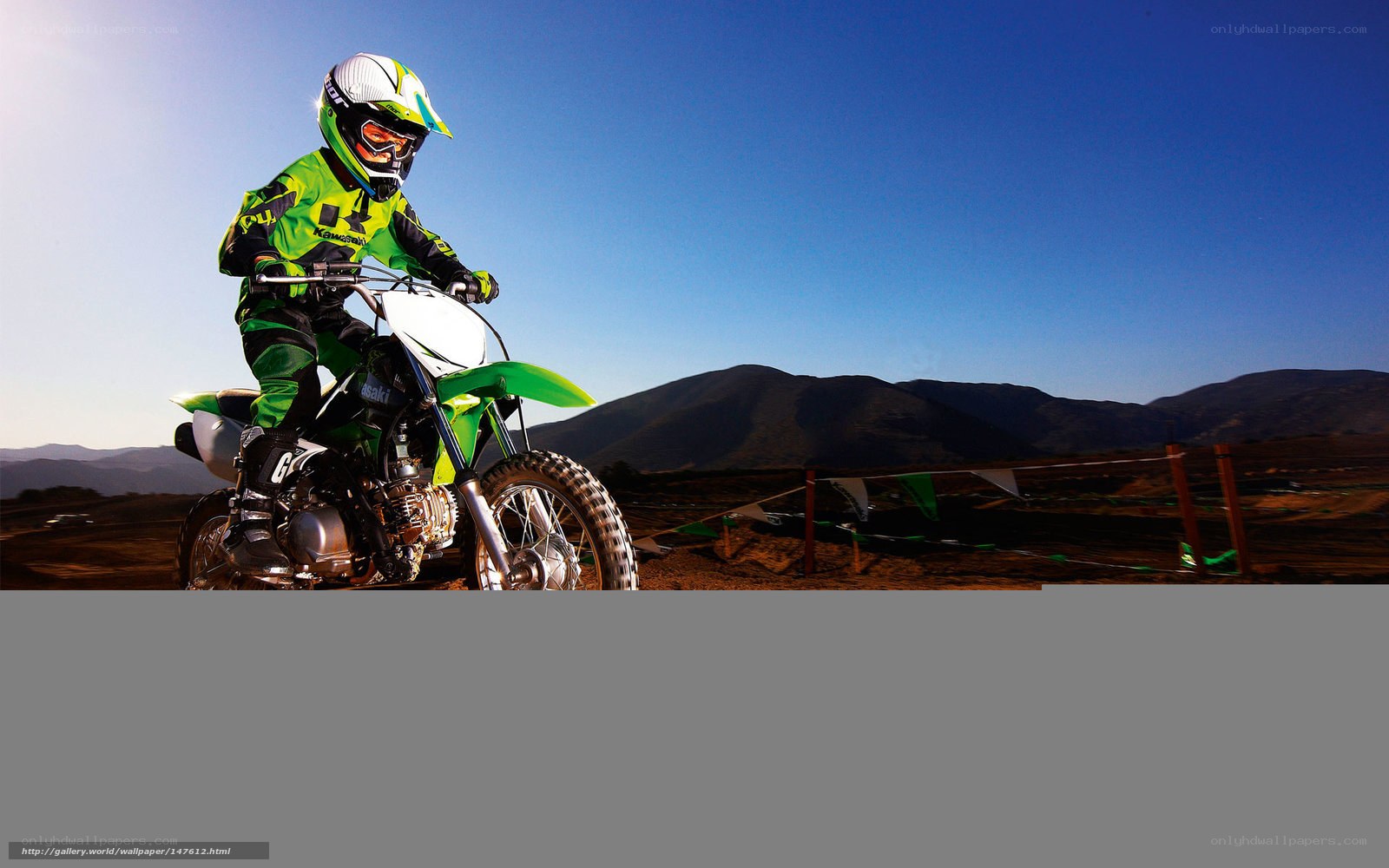 Motocross rider on dirt track