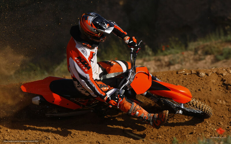 Motocross rider on dirt track