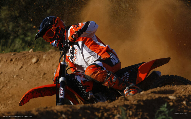 Motocross rider on dirt track