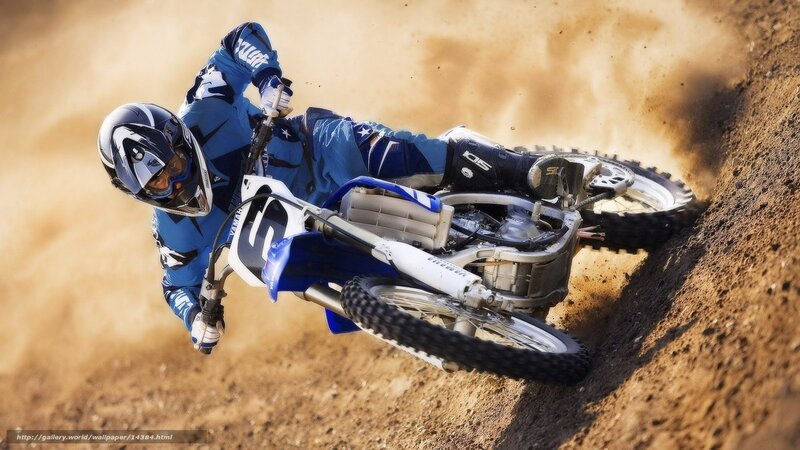 Motocross rider on dirt track