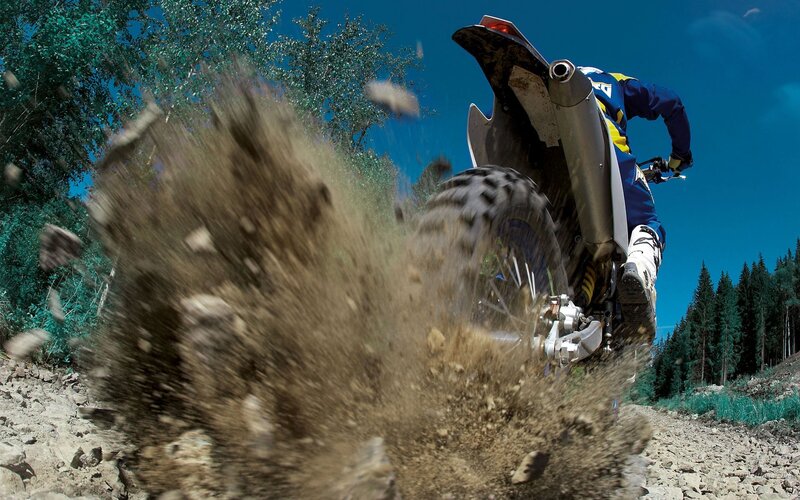 Motocross rider on dirt trail