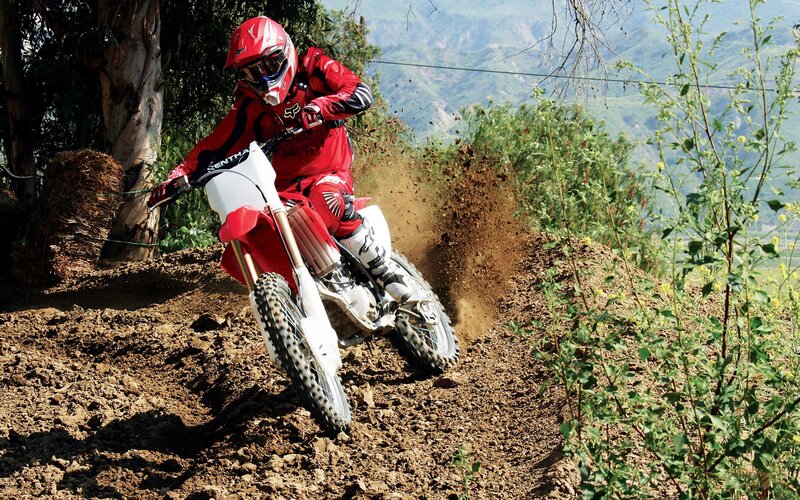 Motocross rider on dirt trail