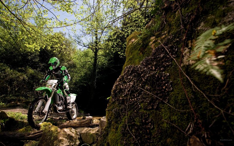 Motocross rider on forest trail