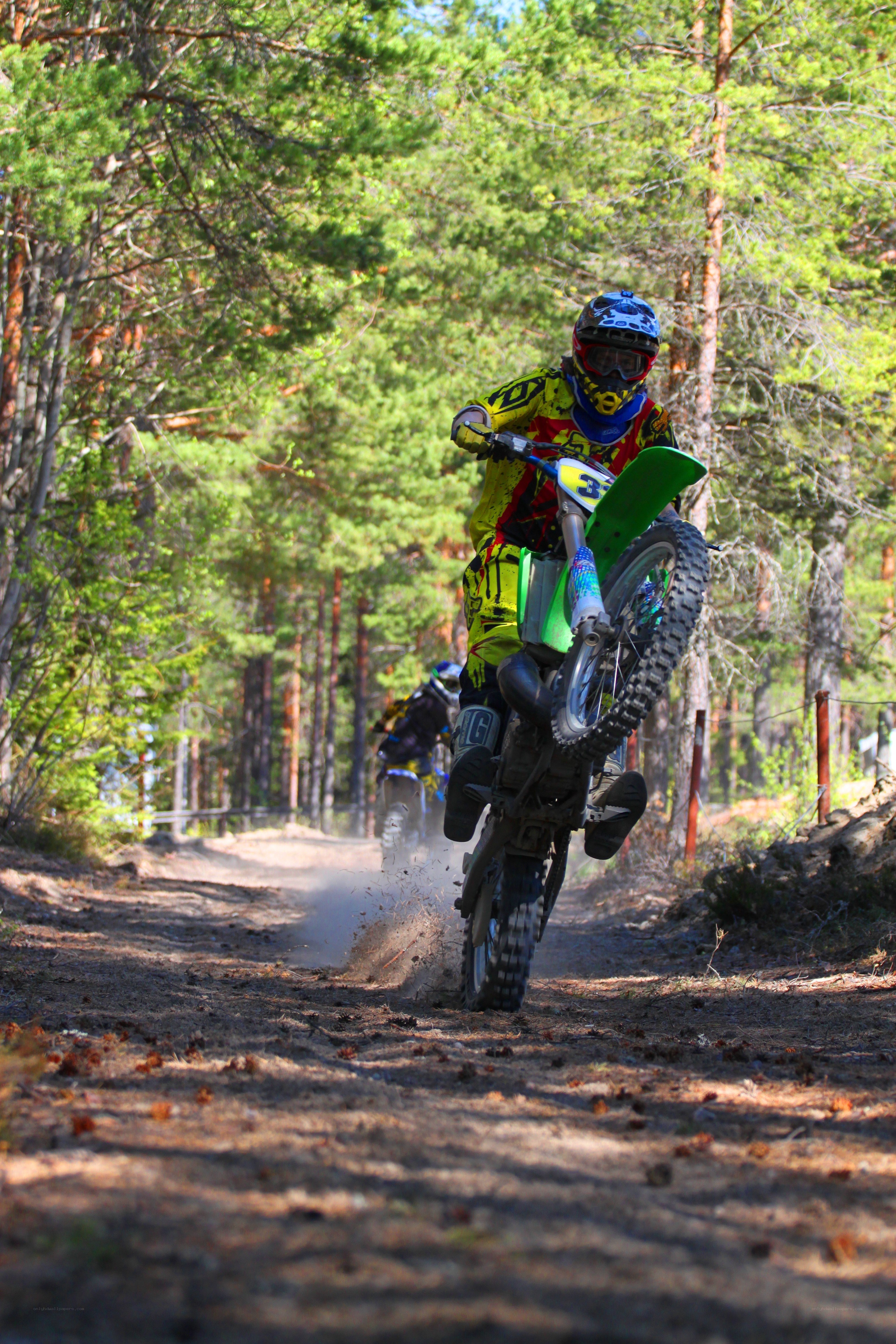 Motocross rider on forest trail