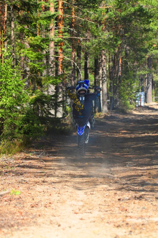 Motocross rider on forest trail