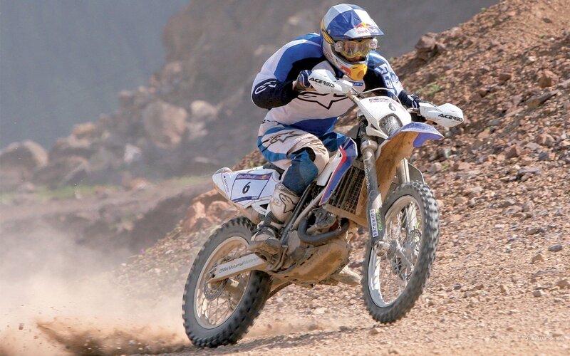 Motocross rider on rocky terrain