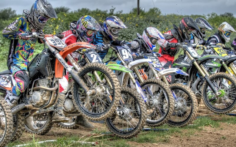 Motocross riders at the starting line
