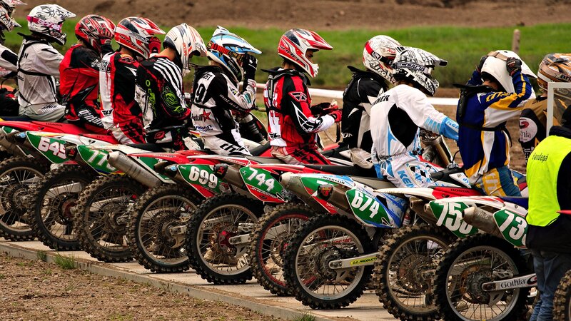 Motocross riders at the starting line