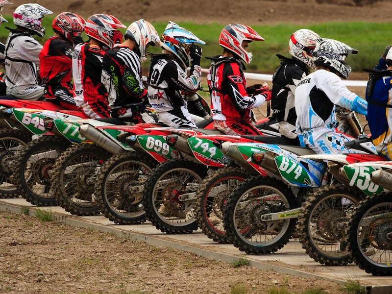 Motocross riders at the starting line