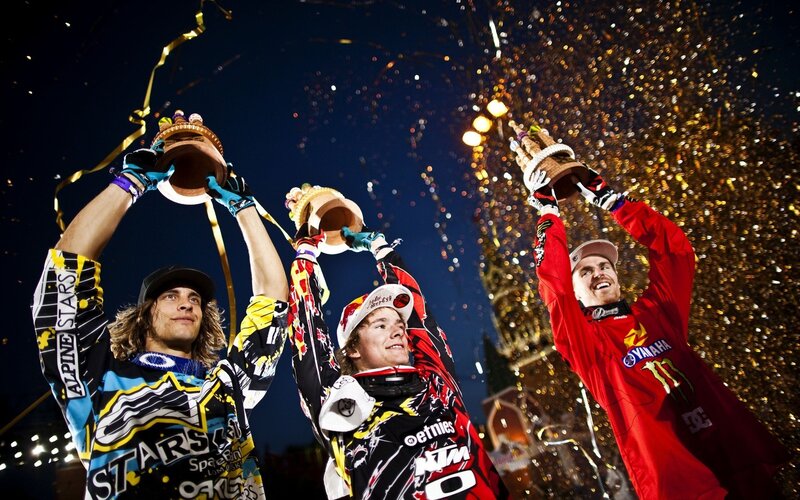 Motocross riders celebrate victory