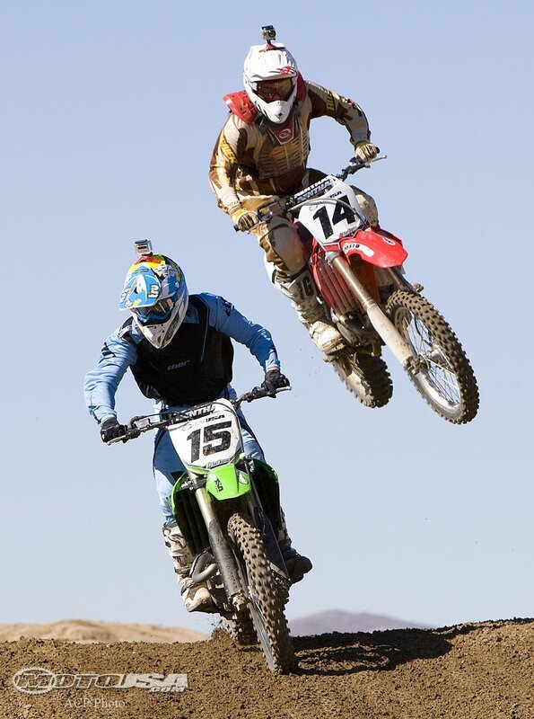 Motocross riders in mid-air