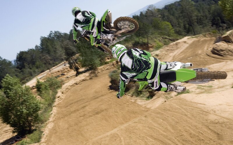 Motocross riders in mid-air
