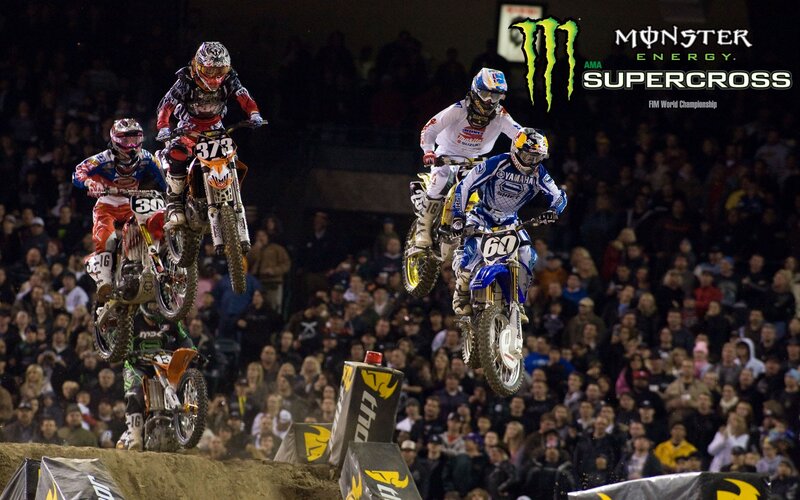 Motocross riders in mid-air