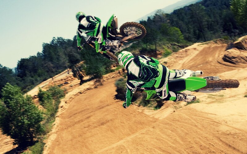 Motocross riders in mid-air