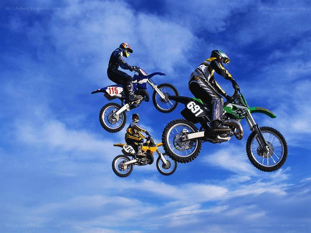 Motocross riders in mid-air