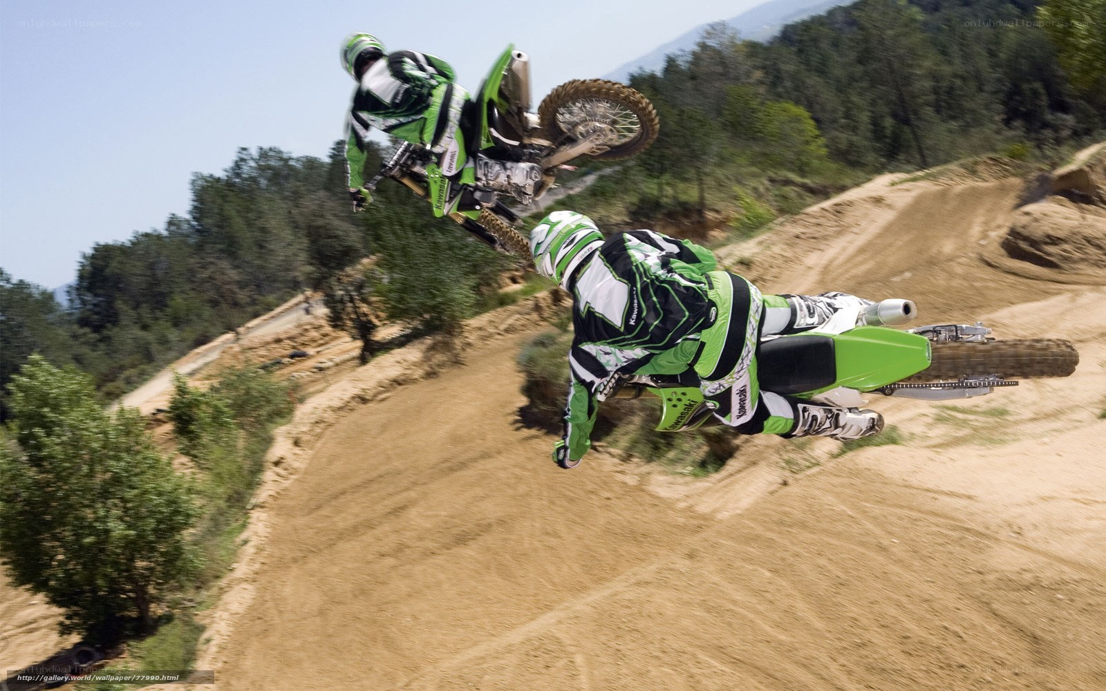 Motocross riders in mid-air