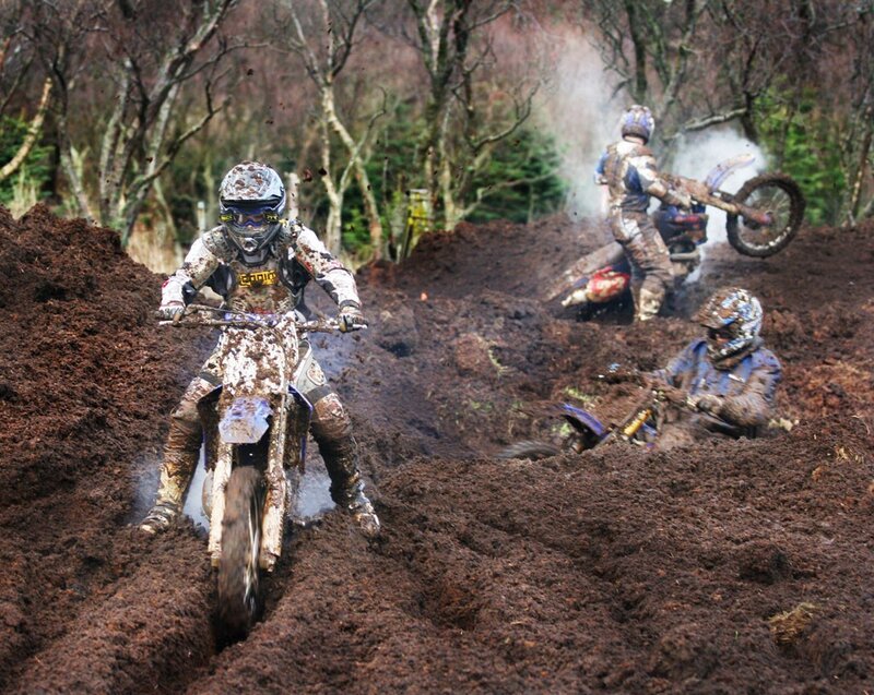 Motocross riders in muddy terrain