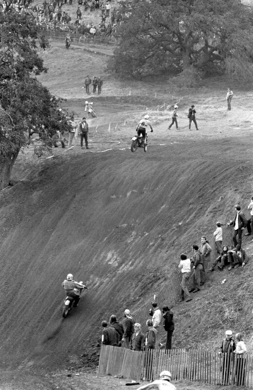 Motocross riders on a dirt track