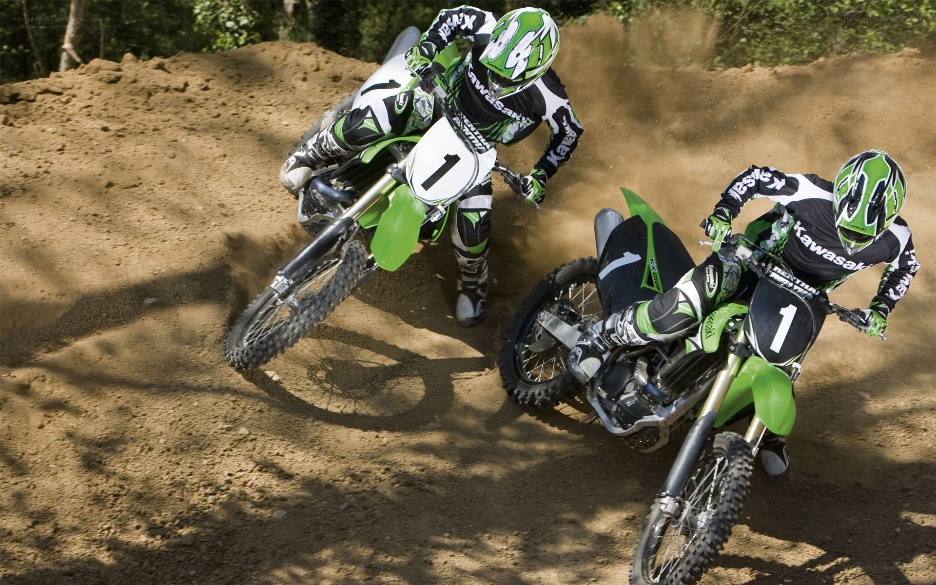 Motocross riders on dirt track