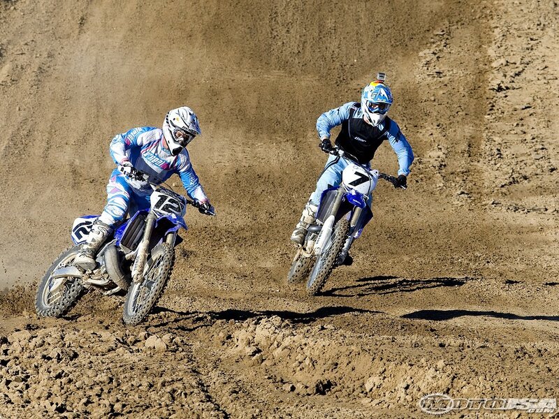 Motocross riders on dirt track