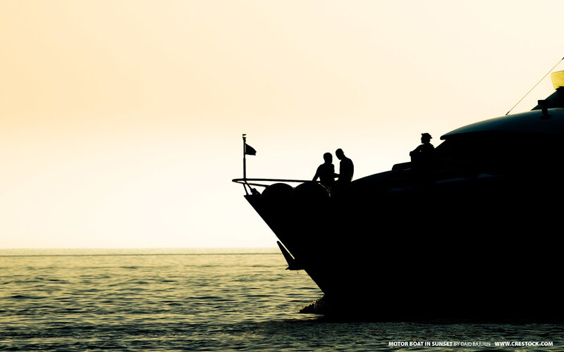 Motor boat at sunset