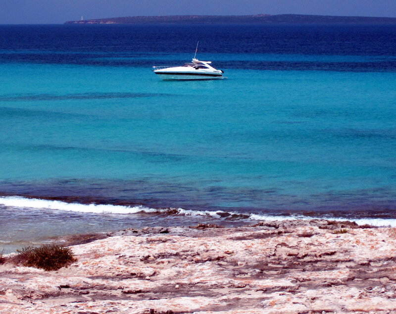 Motorboat in Turquoise Water — Blue