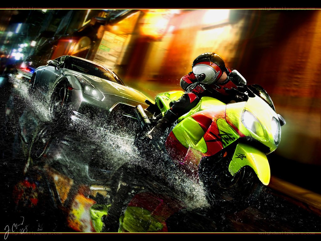 Motorcycle and car racing at night