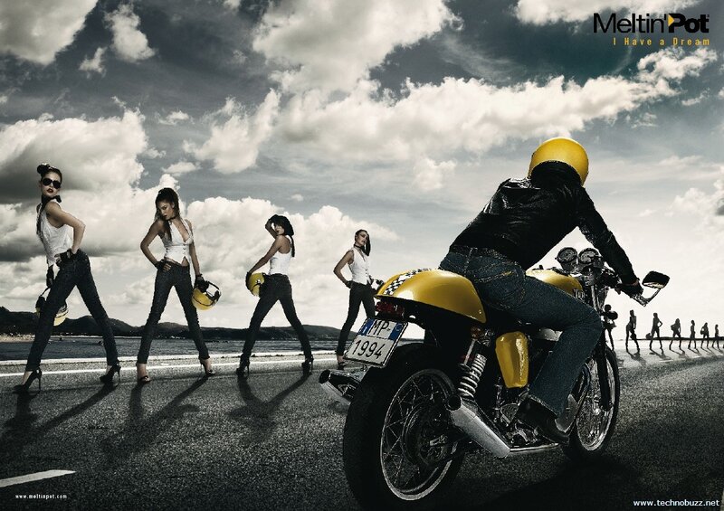 Motorcycle and models on beach road