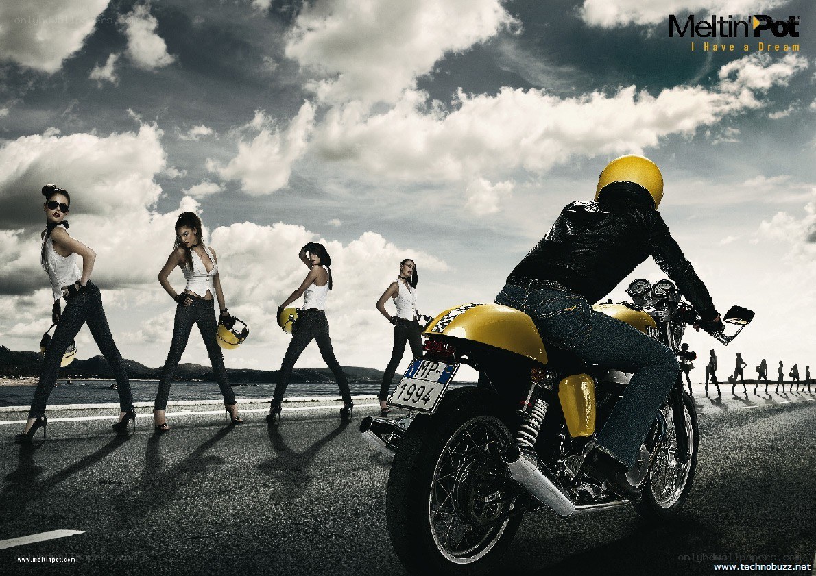 Motorcycle and models on beach road