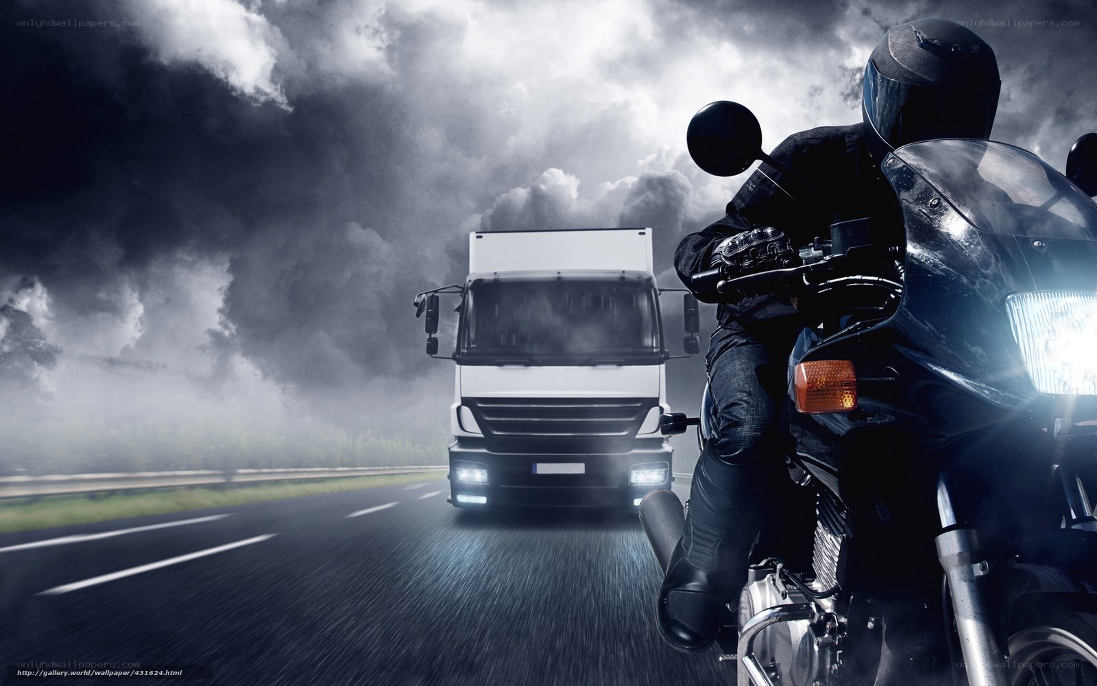 Motorcycle and truck on highway