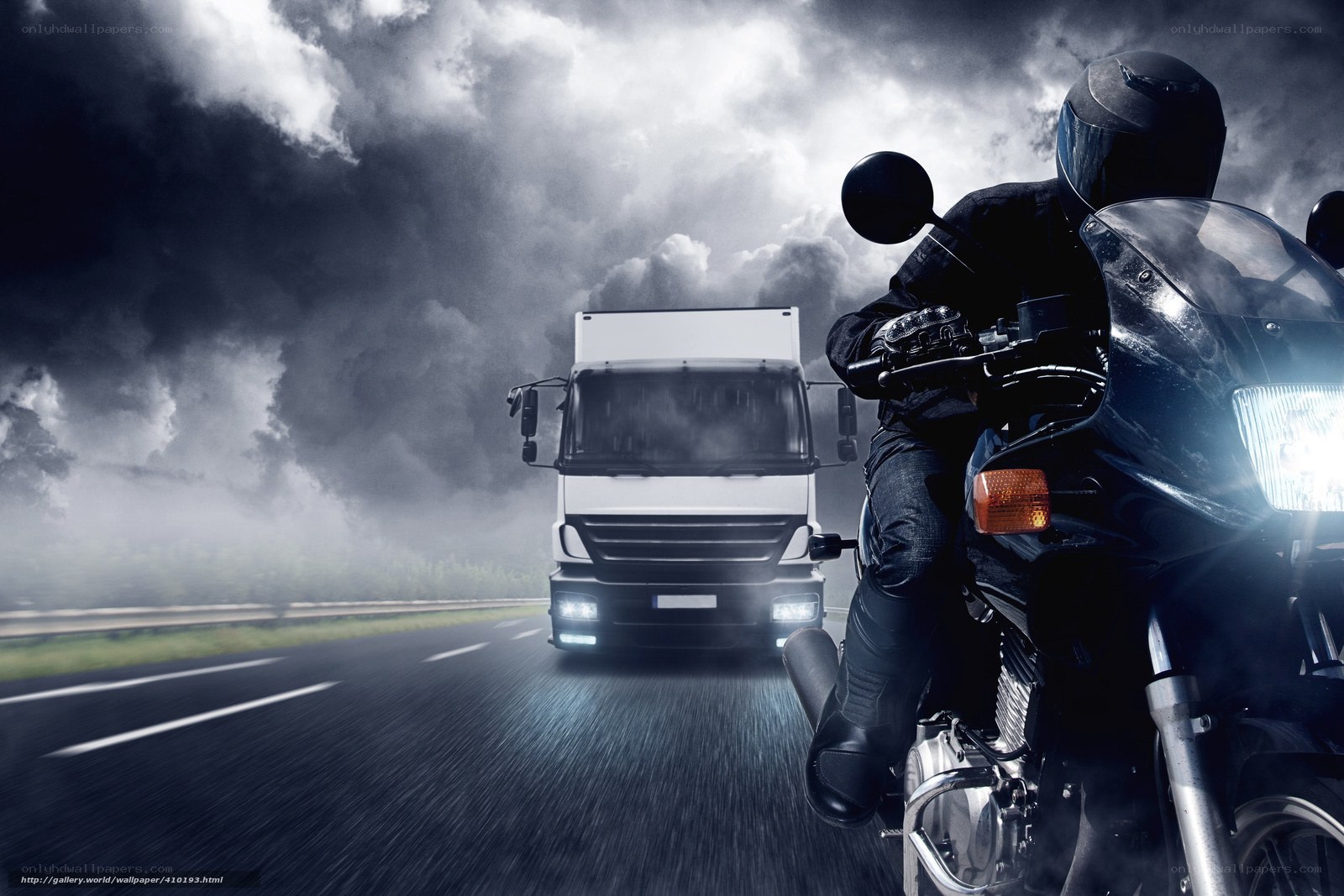 Motorcycle and truck on highway