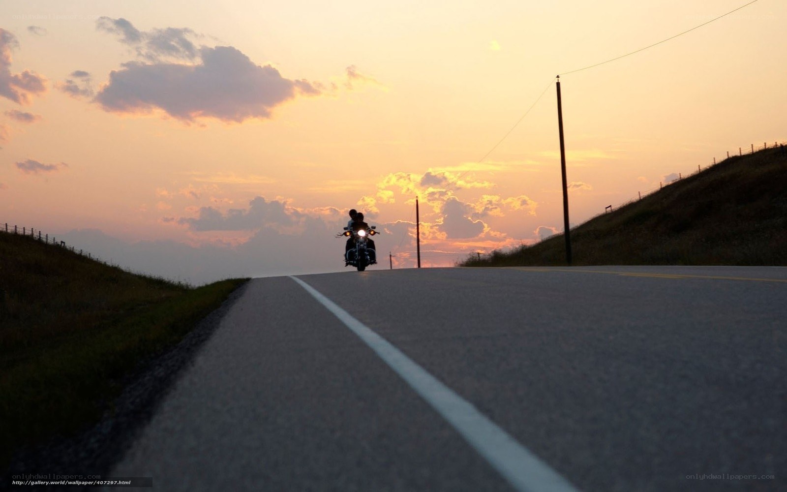 Motorcycle at sunset on country road