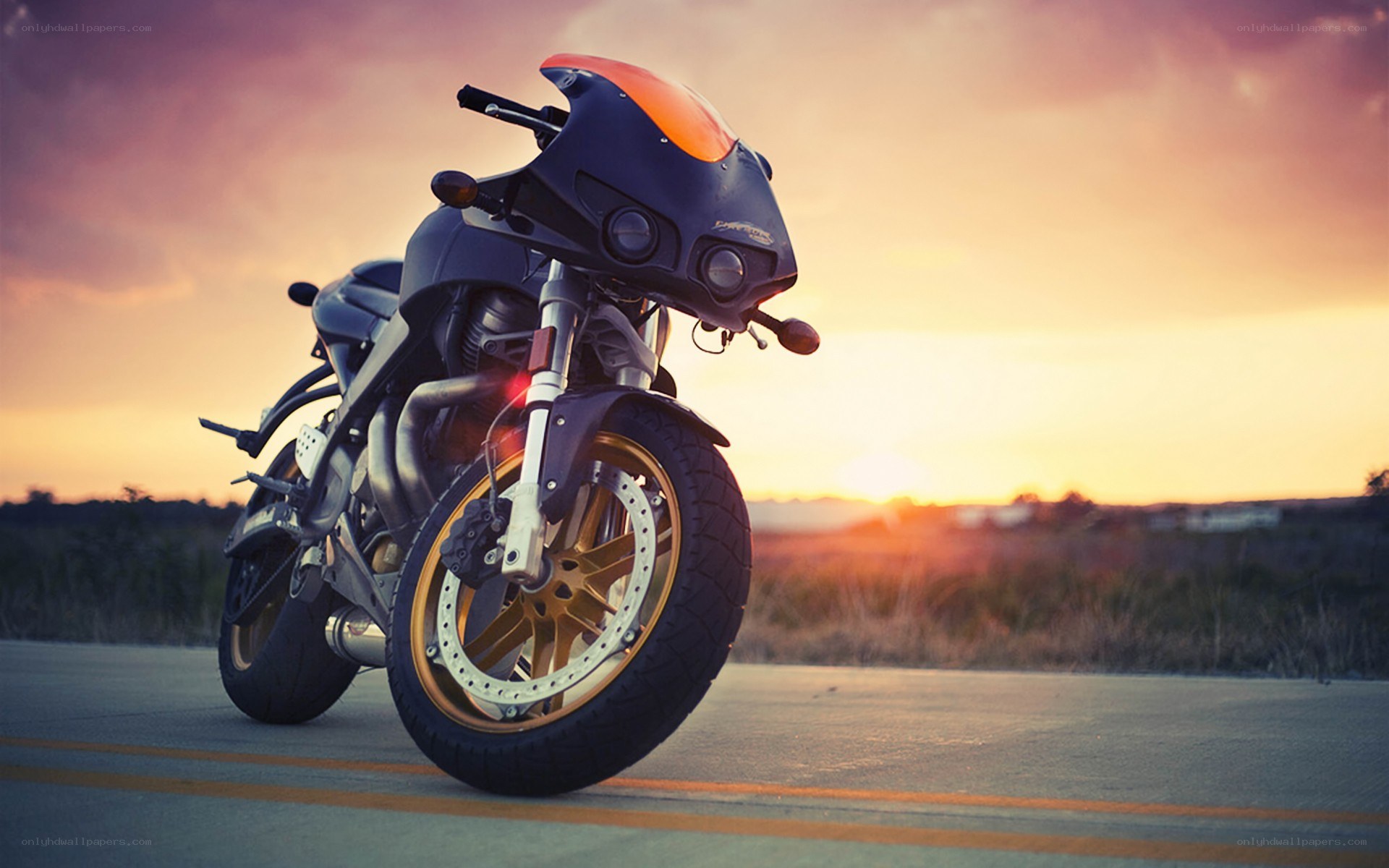 motorcycle at sunset on road