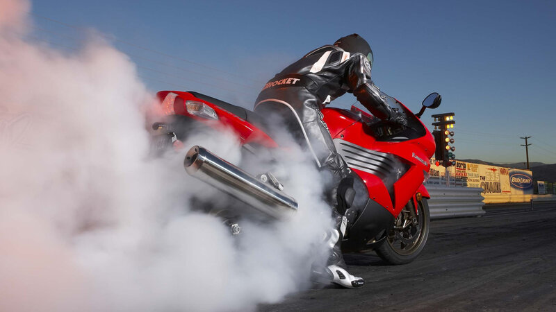 Motorcycle burnout at drag strip