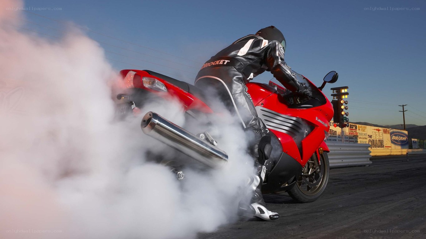Motorcycle burnout at drag strip