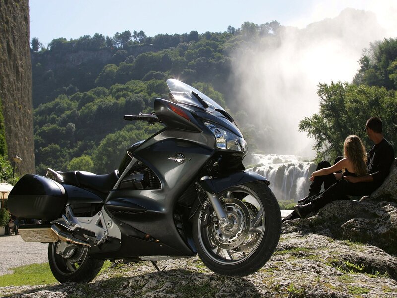 Motorcycle by a waterfall