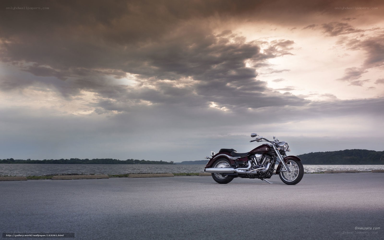 Motorcycle by the lake at sunset