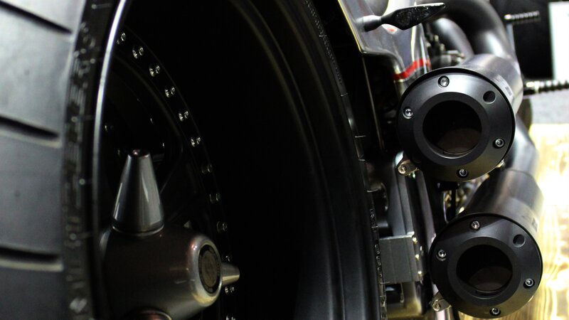 motorcycle exhaust and wheel