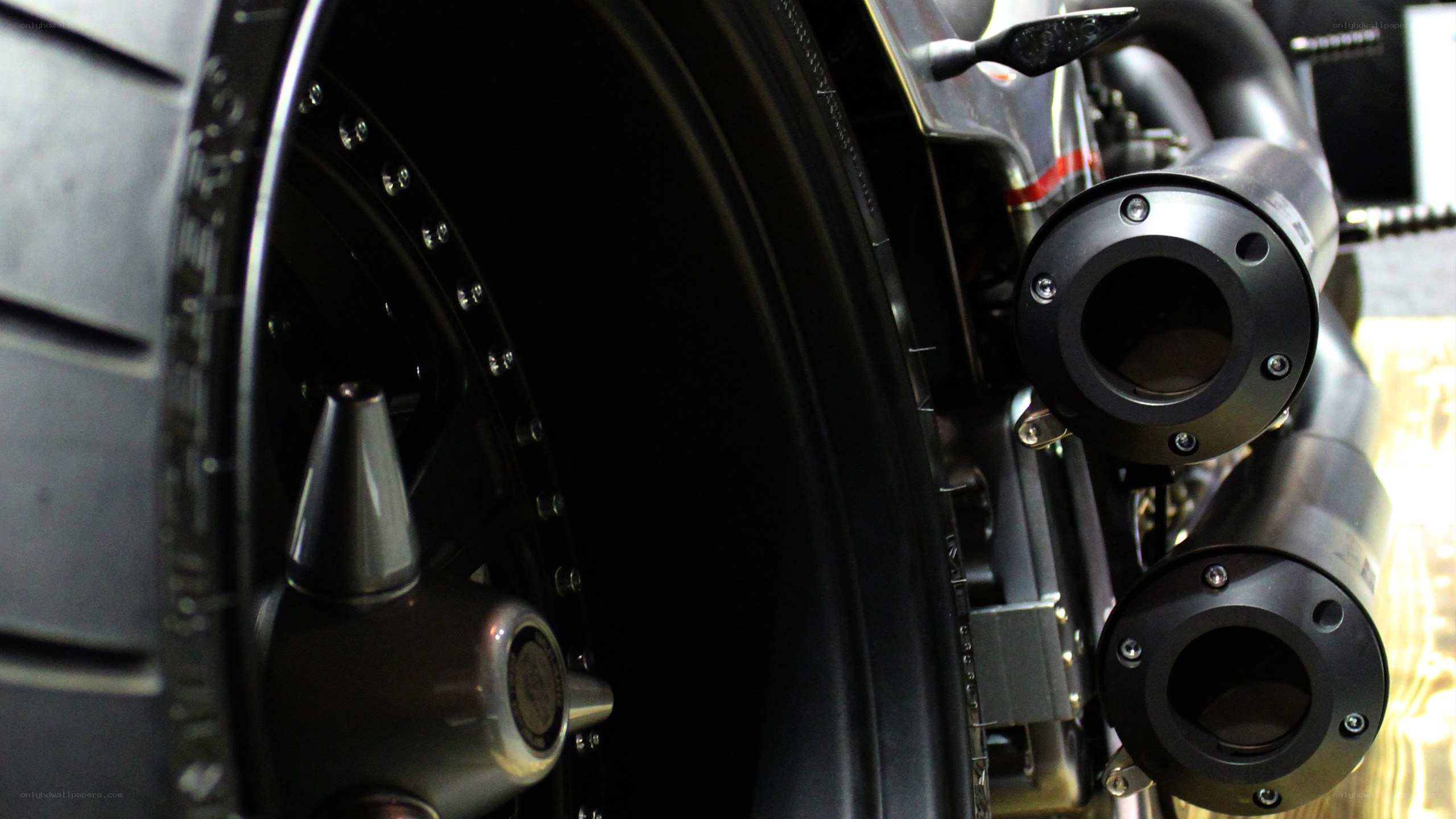 motorcycle exhaust and wheel