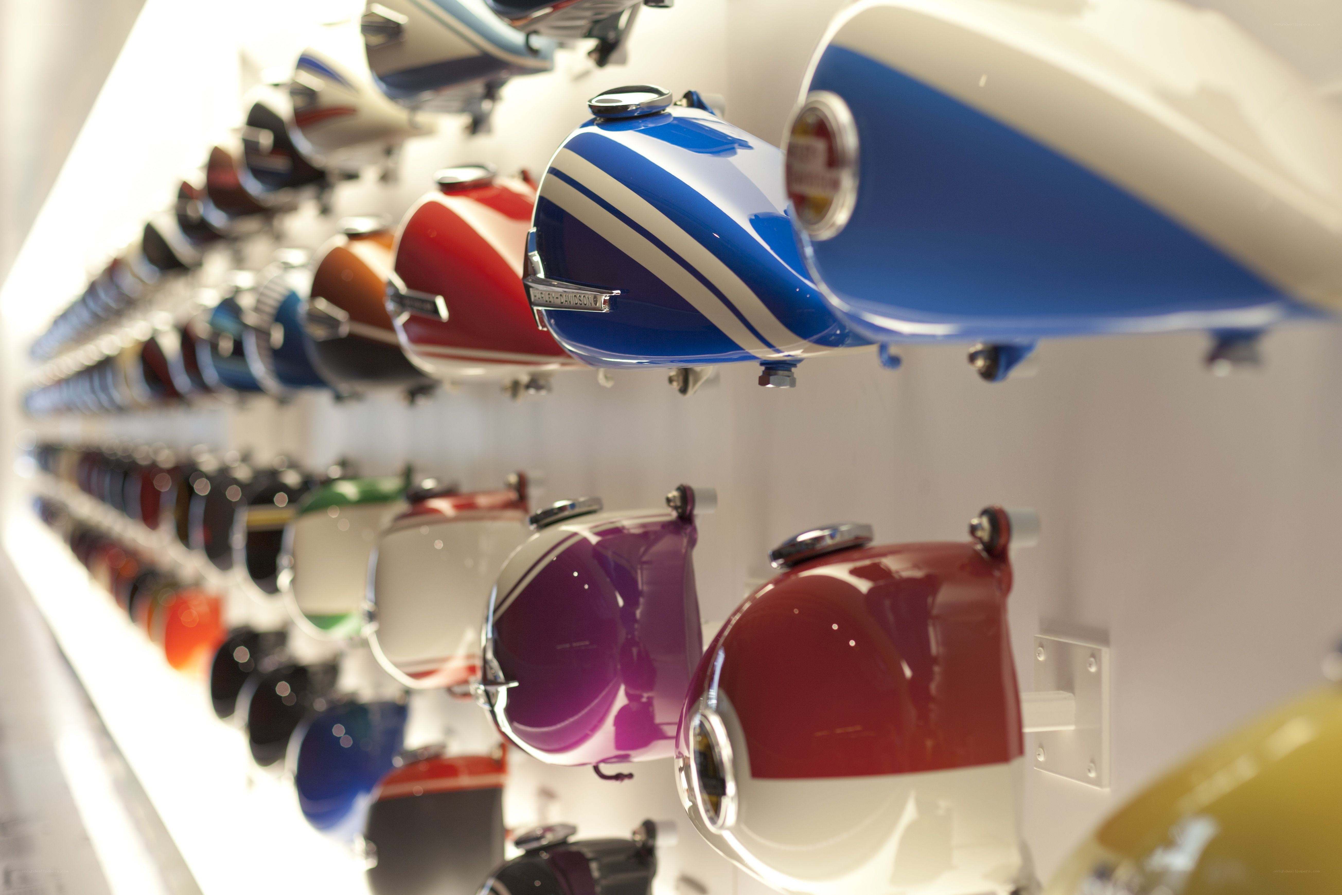 Motorcycle fuel tanks on display